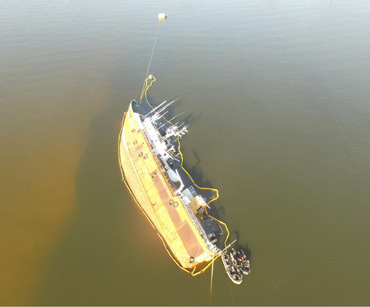 Operation on distressed vessel with deployed containment